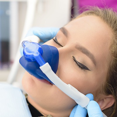 Dental patient receiving nitrous oxide dental sedation treatment