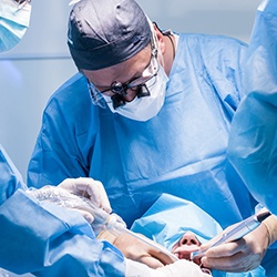 an oral surgeon placing dental implants