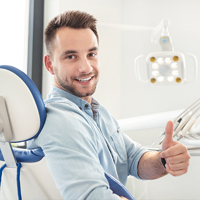 Man giving thumbs up after root canal therapy