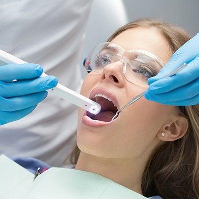 Dentist capture smile images with intraoral camera