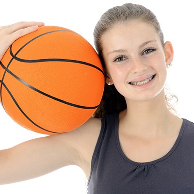 Teenage girl basketball player with braces