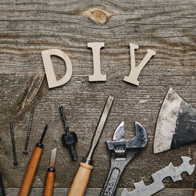 The letters DIY on a workbench